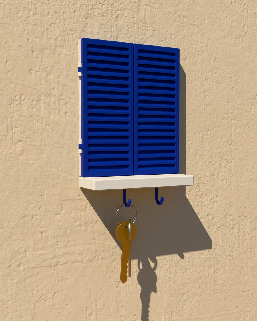 framylo window frame with the blue shutters closed, keys hanging below